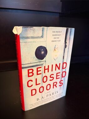 Behind Closed Doors by B. A. Paris - White Cover with Red Text
